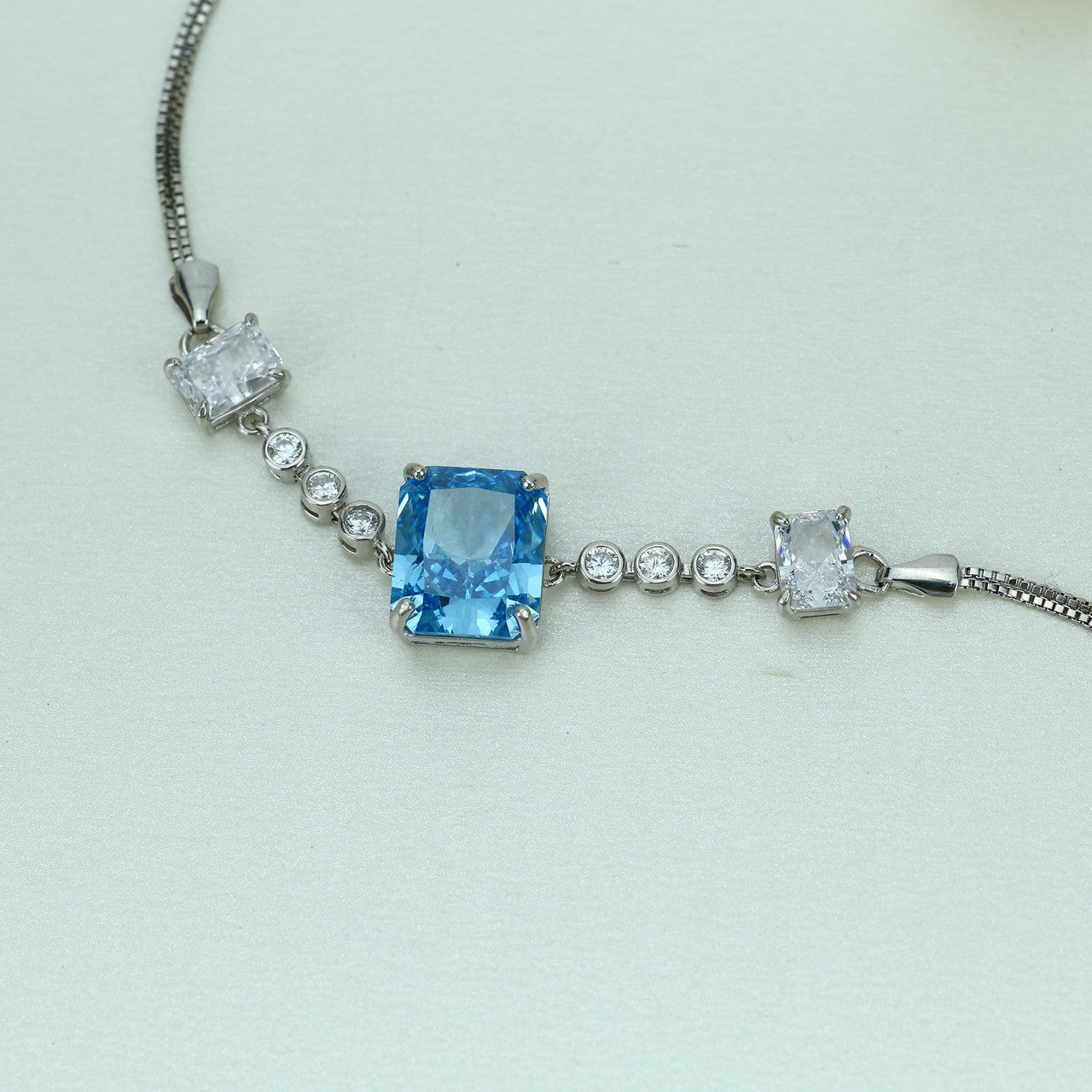 92.5 Sterling Silver Bracelet with Rectangular Light Blue Center Stone